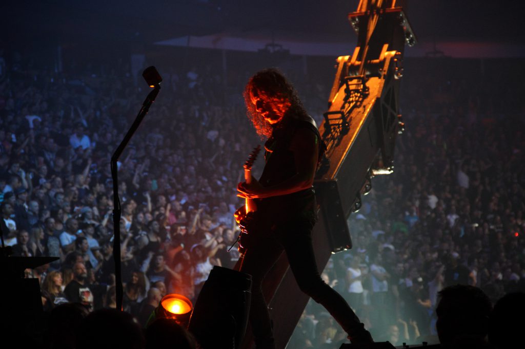 A photo of Metallica performing  on the Through the Never tour stage